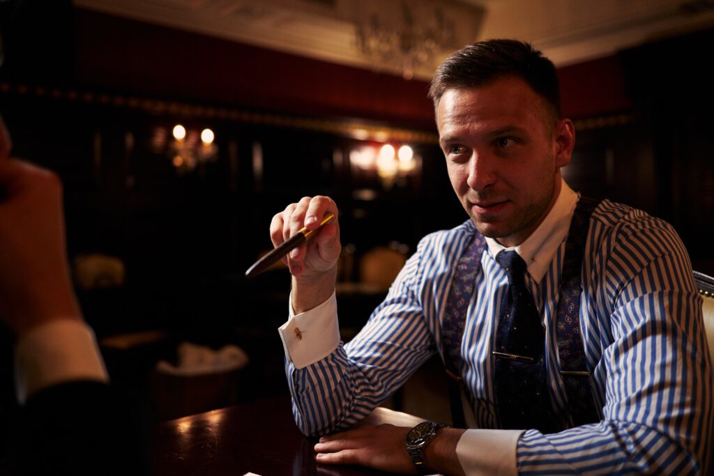 Slick legal, or lawyer looking man in a blue and white striped shirt